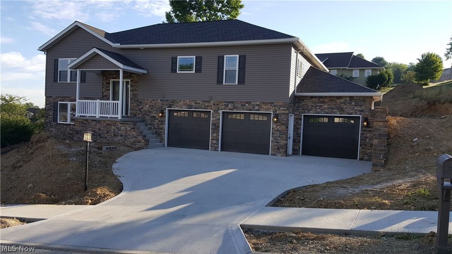 New custom home by designed and built by StrongHome Construction. This raised ranch features an open floor plan with a gas fireplace, a large 3 car attached garage, large covered back porch with great view of the valley, large kitchen with granite counter tops and a unique 5x10 walk in pantry. In the master bedroom there is a large walk-in closet and bath with a custom tiled shower. The lower level features a rec room with hardwood laminate floors and a cherry bar, a bedroom, full bath and mud room.  High quality trim and finishing throughout in this unique design.