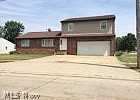 Unique 5 bedroom Split/Ranch. 3 full baths. Spacious eat-in kitchen. Large basement with summer kitchen. 2 garages-one attached. Oversized yard. Bring a little TLC and make it yours!