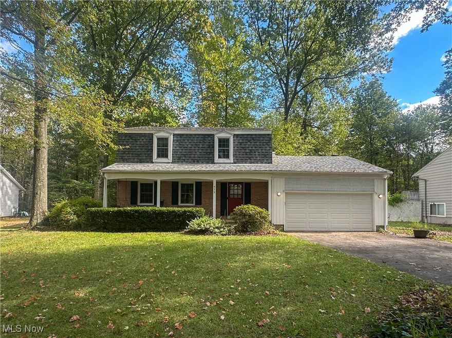 Welcome to this charming 4-bedroom, 2.5-bath home offering comfort, space, and character throughout. Beautiful hardwood floors flow through most of the home, enhancing its warmth and timeless appeal. The inviting family room features a wood-burning fireplace with a gas starter, while the formal living and dining rooms provide elegant spaces for entertaining or family gatherings. The eat-in kitchen and dining area flow perfectly for everyday living. Enjoy outdoor living on the front porch or brick patio overlooking the backyard, complete with a storage shed. The attached two-car garage adds convenience. The full basement includes a bar, laundry room, storage area with built-in shelves, and workshop—ideal for projects or entertaining. Located in desirable Howland Township, close to schools, parks, and amenities, this home is ready for you to move right in!