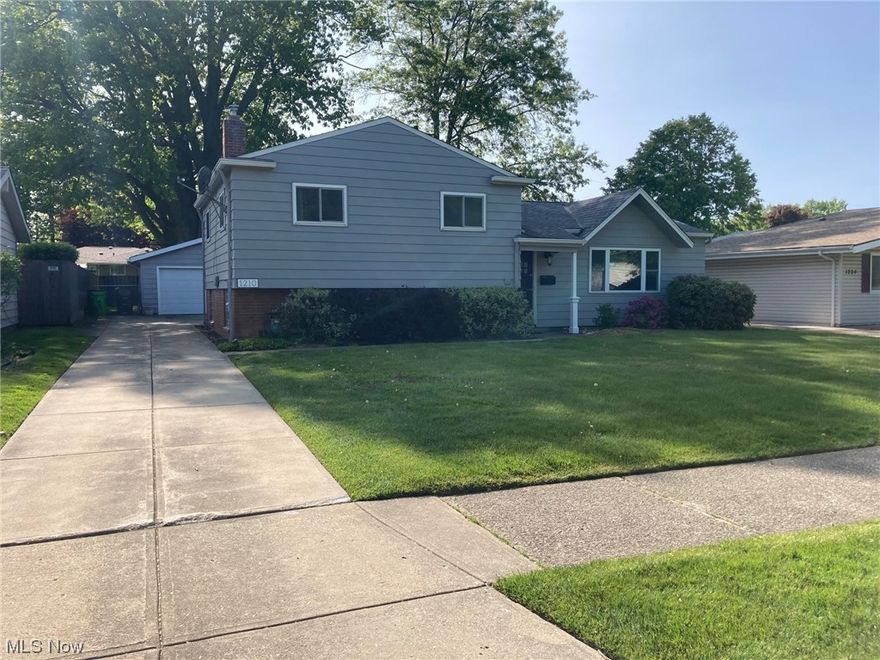 If you are looking for a move in ready home with a large fenced in yard close to all the amenities in Mayfield your search is over! This split level home has been tastefully updated and properly maintained. A concrete driveway with ample parking in the rear leads back to a 2 car garage with automatic door and central drain, you can fit several cars without blocking others in. The beautiful large green space yard is fully fenced in, ready for kids and/or pets to play. Stepping inside the home on the main level you have vaulted ceilings, nice newer plank flooring, a large front window, a dining area with rear sliding patio door, and a beautiful kitchen with a pass through window. Appliances are included, granite countertops. Downstairs is a large carpeted finished area with a walkout door to the rear. The laundry, utilities, and a half bath are located downstairs in the unfinished area. Washer and dryer are also included. Upstairs you will find the full bathroom and 3 bedrooms. The bathr