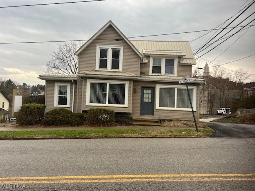 Attention Investors! This property has been used for commercial purposes since at least the 1970s. It was initially built as a single-family house, but over the years, it has undergone numerous remodels and changes. The house is located in a commercial area, but it could be renovated to accommodate a single-family home or duplex. The house has two entrances, making it feasible to convert it into a duplex. This property has included tenants such as a mental health therapy office, an accounting firm, a security company, and a boutique, among others. There are two lobby areas, four rooms, and a half bath on the first floor, and three rooms and a half bath on the second floor. This house has no kitchen, no closets, and no shower or bathtub. There is parking for approximately. 10 cars. Located 1/2 block from the high school and downtown—next door to Giacinta's coffee and Gelato shop. The roof is 3 years old. The high-efficiency Furnace and A/C are 8 years old, and the windows are 12 years old. Old. The foundation is made of sandstone and is very sturdy. What could YOU do with this charming property in downtown St. Clairsville? Remodel it back into a residential home or duplex? Use it as rental office space? You decide! This property R/E agent-owned.