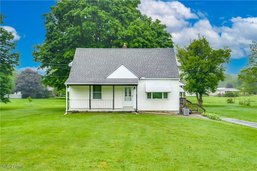 Welcome to this delightful 3-bedroom, 1-bath Cape Cod nestled in the heart of Mogadore Schools. Sitting on an impressive 1.65-acre lot, this home combines comfort, charm, and space — both inside and out! Step inside to find two spacious bedrooms on the main level, each with generous closet space, and a full bathroom conveniently located nearby. The bright and inviting living room offers a wonderful view of the neighborhood, perfect for relaxing or entertaining. The kitchen is a standout feature with ample countertop space, abundant cabinetry, and a view that overlooks the scenic backyard. Upstairs, you’ll fall in love with the cozy third bedroom, beautifully finished with classic knotty pine — a warm and rustic retreat. The lower level offers a clean and versatile area for storage or hobbies, and it walks out to a backyard that’s truly a showstopper. Enjoy the serenity of your private 1.65-acre yard, complete with mature trees, open green space, and an additional barn — ideal for storing lawn equipment, tools, or even turning into your dream workshop. Don’t miss this rare opportunity to own a beautiful home with room to grow, inside and out!