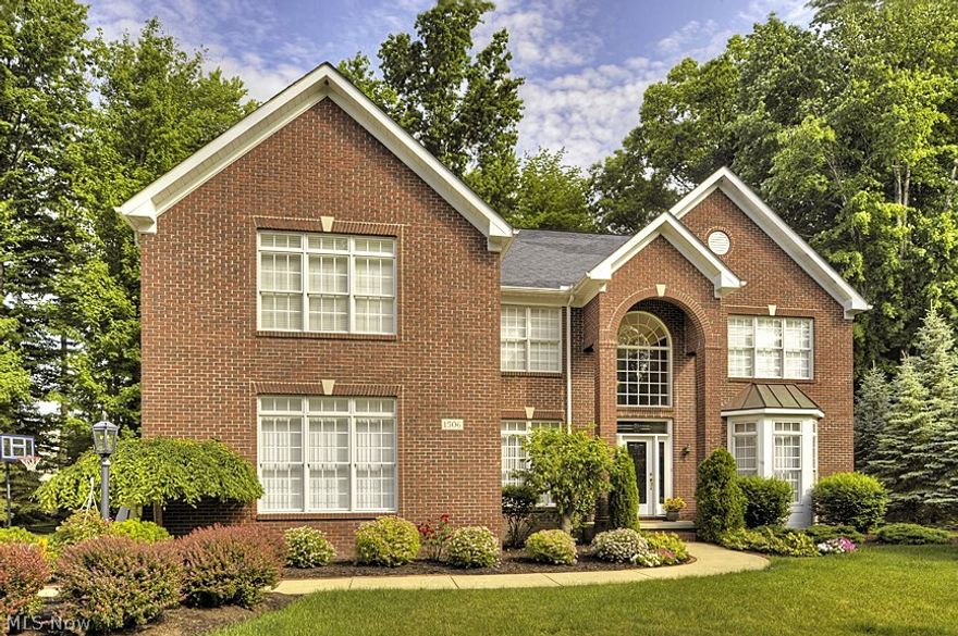 This fabulous home offers quality and upmarket design features – while providing the warmth and ease for a casual lifestyle. Striking curb appeal, spacious interior, and kid-friendly environment plus close proximity to Crocker Park shopping, entertainment, parks and highways.  Special features include granite countertops, hardwood, arched openings, warm wood cabinetry and custom fireplace with a stone hearth.  The floor plan is inviting and open with a two-story foyer, curved staircase vaulted great room, formal and casual dining areas, den/sitting room, gourmet kitchen, spacious sunroom, expansive master suite with lavish bath, four additional bedrooms (one on first floor – great for guests or teens), a huge basement - ready for finishing - plus a large deck and private patio that expands your living space to the outdoor park-like setting.