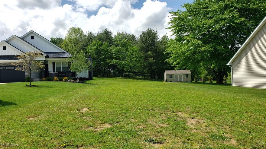 Ready to build, 1/4 acre cleared lot in Garrettsville Village. There are restaurants, grocery stores, a cinema, drug store, post office, a boardwalk waterfall, Dairy Queen, and more all located within walking distance of these new homes. The location is within 30 minutes of Solon via easily accessed RT 422. Underground utilities (GAS, ELECTRIC, WATER, and SEWER) available - NO SEPTIC SYSTEMS! This is a very welcoming community of friendly neighbors and lifetime friends that are all proud to call Garrettsville, Ohio home. Bring your own builder or meet with some of our builders that have built several new homes in Fox Hollow. Lot#15 on map.