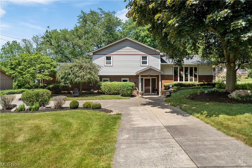 Perfectly situated in a quiet, no-outlet neighborhood, 239 Hillsdale Circle in Wadsworth is where you will find city conveniences combined with the privacy, beauty, and comfort of a mature & spacious lot.  This expansive split-level home on nearly 1 acre is sure to please its next owner AND their guests! From the outside in, pride of ownership is evident, and the seller is excited to share this home with you. Inside you have 4 levels of finished living space which includes 3 bedrooms & 4 bathrooms. Laundry is on the main level. The cozy family room boasts a stone wall w/gas fireplace, and brand-new carpet, blinds, and Pella sliding patio door. The 2nd level features a cathedral ceiling over the living room & beautifully remodeled kitchen, large windows, and another sliding door to the tiered deck! The 3rd level is where you’ll find the bedrooms. One room is being used as an office. The master suite offers plenty of closet space and a gas fireplace! The walkout basement makes the perfec