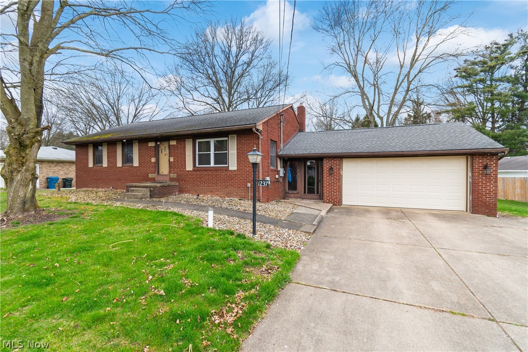 Welcome to this inviting brick ranch in Green LSD! Located in Rolling Green Estates, this home offers ample space with a generous size kitchen, dining area, 3 bedrooms on the main level, and a 4th option in the finished basement with an egress window! The finished basement also offers a 2nd kitchen, bathroom, rec room, and a workshop which includes a compressor that runs to the garage. Coax cable outlets have been run throughout the home. A breezeway leads to the garage and also to the screened in back porch, overlooking the serene backyard. Updates include: Well pump and lines going to house- May 2024, whole house insulated-2022, Furnace and HWT-2014, Roof-2012 Patio roof-2015.