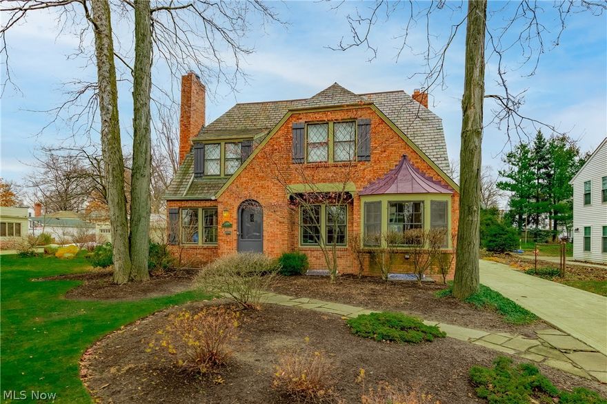 Storybook Brick Colonial offers so much character and so many updates along with pretty architectural details throughout!