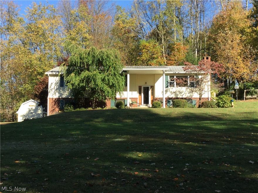 Lovingly cared for low-maintenance Brick & aluminum home on 4 lots totaling almost 1-3/4 Acres with very nice privacy. The lot has a very gradual slope which provides nice views while making the lawncare very easy (especially compared to many Lake Buckhorn lots). You will find 3 Bedrooms including a private master suite with its own private master bath and large closet. There is a really nice 23 x 17 family Room on the lower level with a lovely stone fireplace wall with a woodburning insert. This spacious area will be your retreat creating warm, cozy memories.  There is a truly beautiful, large  stamped concrete patio off the dining room/kitchen eating area. There is a large 2-car garage under the west side of the home.