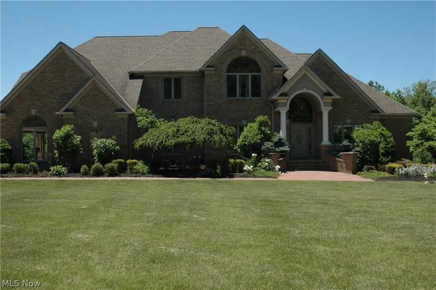 This beautiful, 5 bedroom 4.5 bath, all brick colonial is located in Hinckley's coveted Preserve at Wakefield Run development.  The property is a corner lot that abuts a conservation area. The home features silent flooring and is adorned with exotic hardwood floors. First floor master suite with glamour bath and large walk in closet.  The living room boasts a marble fireplace surrounded by a wall of windows.  Gourmet kitchen with granite counter tops and SS appliances including Viking dishwasher and ove rsized Jen Air double oven.  A stamped concrete deck with sandstone pillars is off the kitchen. The second floor has four spacious bedrooms with two full bathrooms. Each bedroom has its own sink and vanity area as well as walk in closet.  The award winning walkout lower level has been featured on the cover of remodeling magazines. The lower level offers 2000+ square feet of additional living space with exercise room, full custom bar with granite counter tops, 15 course block, full bathr