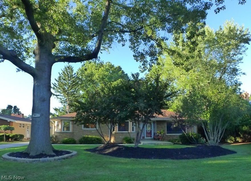 Stunning! This Edgewater Park ranch home shows like it's from the pages of magazine! Current owner has extensively remodeled this impeccable home with the utmost attention to detail & high end finishes. From the beautiful all new window casings, crown moldings, solid wood doors on the main floor to the refinished hardwood floors, new lighting, paint, carpeting & much more on the main floor. Step downstairs to the incredible lower level which has been refinished & renovated to incorporate a huge Rec room, w/stone decorative fireplace, new carpeting, large bonus/workout room, 4th bedroom and full bathroom with shower!  Remodeled eat-in Kitchen with custom lighting, granite counters, ceramic tile floor and all new stainless steel appliances. There are 3 bedrooms and 2 full baths on the main floor, access to new private concrete patio and landscaped yard. All mechanicals high efficiency furnace, hot water tank & central AC with heat pump! 2 car detached garage and storage shed. All of this