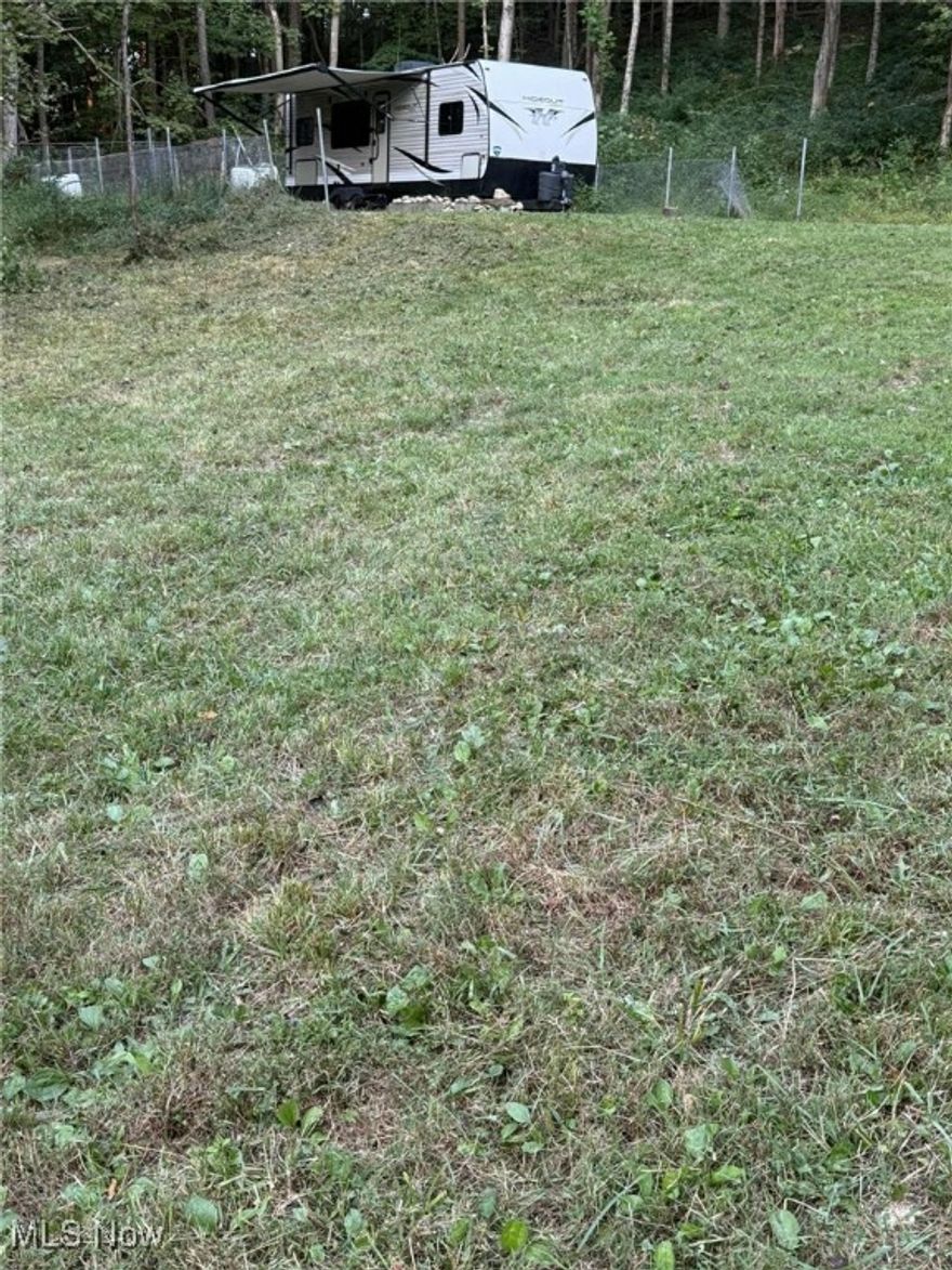 This property is Beautiful and a great fit for recreational time and enjoyment. Whether you love to hunt, 4-wheel, of just relax. Property offers a secluded site with 200 amp electric service (with a 32 ft. camper which is negotiable with the sale of this property). Mostly Wooded with young timber, 2 under developed springs, creek runs full length of property. Rolling & rough terrain with road frontage on Olney Run Road and State Route 266. You do not want to overlook this unique offering located in scenic, Historic, Morgan County, Ohio. Give the agents a call for your private showing today.