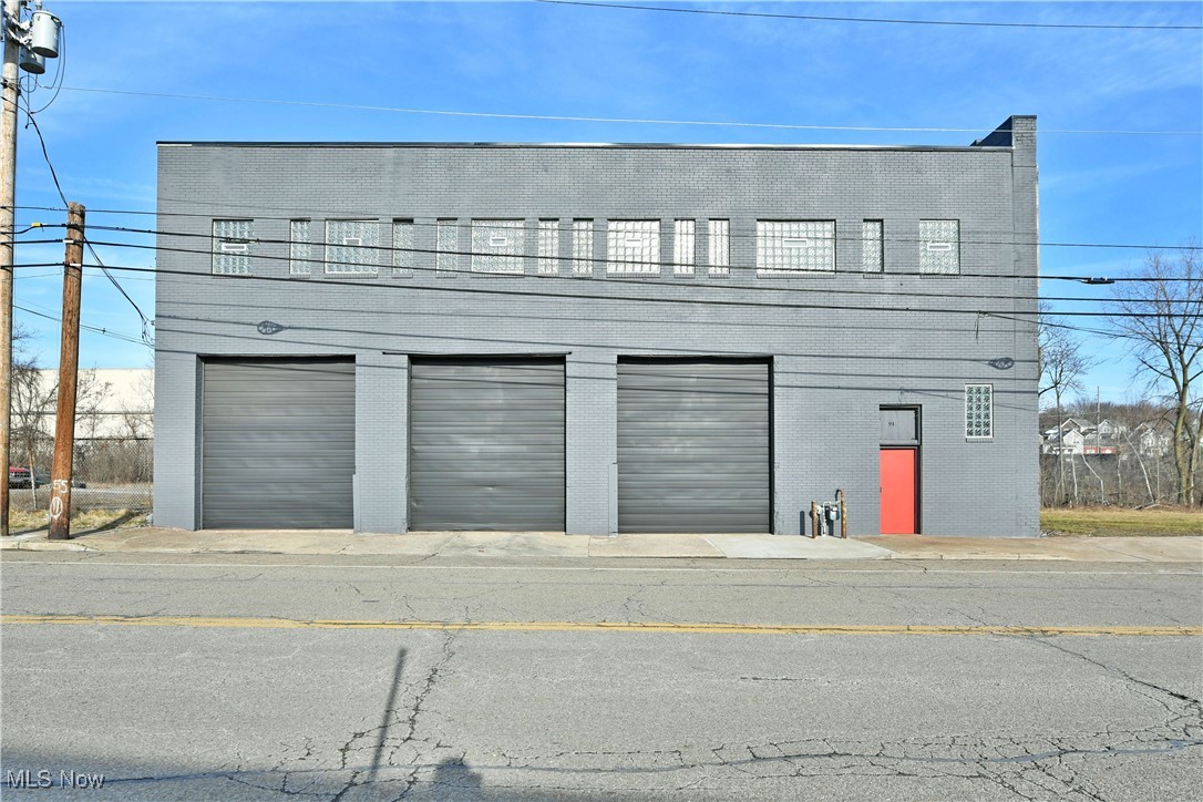 This 19,968 sq/ft building can be repurposed for almost any need or current condition is ideal for warehouse, industrial or distribution. With a location that offers easy access to expressways, as well as four adjacent lots for future building additions, outside storage or parking. Three oversized loading doors grace the front of the resounding brick exterior, and its freshly updated facade all topped with a brand-new roof. Two loading docks include an extra wide central ramp for easy tow motor and vehicle access to main floor. A full front office includes a spacious clerical portion to include a public restroom. Across the hall, a second office oversees warehouse activity. Secondary entry doors secure the storage from the loading areas as the concrete floors run underfoot. Glass work accommodates the dry and hassle-free block construction. At the rear of the floorspace, an additional bay door leads to a rail friendly exit. Nearby the loading dock sits a conveyer belt system and lift access is available for second floor inventory access. A row of new glass block adorned offices line the front wall of the second floor with bathroom provisions. The remaining warehouse space expands outward, continuing with its robust, exposed truss and beam design.