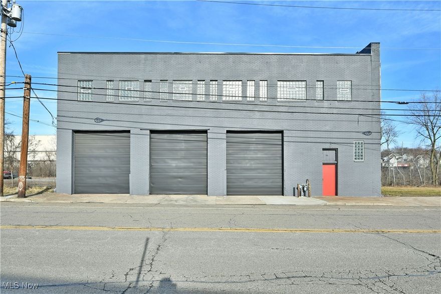 This 19,968 sq/ft building can be repurposed for almost any need or current condition is ideal for warehouse, industrial or distribution. With a location that offers easy access to expressways, as well as four adjacent lots for future building additions, outside storage or parking. Three oversized loading doors grace the front of the resounding brick exterior, and its freshly updated facade all topped with a brand-new roof. Two loading docks include an extra wide central ramp for easy tow motor and vehicle access to main floor. A full front office includes a spacious clerical portion to include a public restroom. Across the hall, a second office oversees warehouse activity. Secondary entry doors secure the storage from the loading areas as the concrete floors run underfoot. Glass work accommodates the dry and hassle-free block construction. At the rear of the floorspace, an additional bay door leads to a rail friendly exit. Nearby the loading dock sits a conveyer belt system and lift access is available for second floor inventory access. A row of new glass block adorned offices line the front wall of the second floor with bathroom provisions. The remaining warehouse space expands outward, continuing with its robust, exposed truss and beam design.
