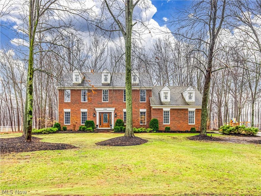 Rare opportunity in this gorgeous Hudson home. Located in the highly sought-after Bridgewater Place neighborhood on just under an acre of land, the elegance and charm of this home are unmatched. Enter through the front door to experience a grand two-story foyer, oversized crown moldings, custom faux finished walls, and newer wood floors throughout. No detail is overlooked in the fully renovated kitchen. Expansive island with low-maintenance quartzite countertops, seating and storage. Custom ShowPlace cabinets. Viking stove with upgraded hood system. Monogram microwave, fridge and additional oven. The kitchen overlooks the large family room with a distinguished fireplace and custom beams as the focal point. The sophisticated dining room is waiting to entertain. Expansive living room, large office, updated half bath and first-floor laundry complete the first level of this home. The Master BR has a vaulted ceiling, En Suite bath, and 2 walk-in closets. The updated master bath is a piece of art with a fully tiled walk-in shower (double shower heads), tile floors, granite counters, double sinks, and linen closet. 3 additional bedrooms and an updated full bath on the second level. There is an additional 686sq. ft of finished living space in the lower level with two expansive storage areas. The oversized sliding door to back deck illuminates light through the kitchen offering a beautiful view of the private outdoor space. The backyard has multiple places to enjoy including a multilevel no-maintenance composite deck with built-in grill/prep space, patio with firepit, and therapeutic waterfall feature. This home is truly one of a kind and has been so well-loved; it's just waiting to be loved by YOU! Call for your private showing today.