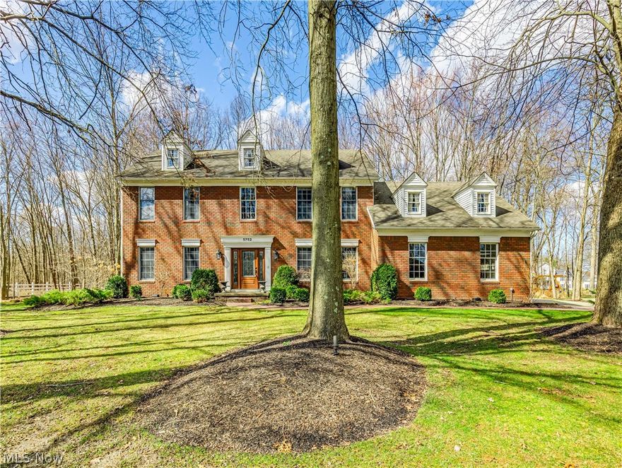 Rare opportunity in this gorgeous Hudson home. Located in the highly sought-after Bridgewater Place neighborhood on just under an acre of land, the elegance and charm of this home are unmatched. Enter through the front door to experience a grand two-story foyer, oversized crown moldings, custom faux finished walls, and newer wood floors throughout. No detail is overlooked in the fully renovated kitchen. Expansive island with low-maintenance quartzite countertops, seating and storage. Custom ShowPlace cabinets. Viking stove with upgraded hood system. Monogram microwave, fridge and additional oven. The kitchen overlooks the large family room with a distinguished fireplace and custom beams as the focal point. The sophisticated dining room is waiting to entertain. Expansive living room, large office, updated half bath and first-floor laundry complete the first level of this home. The Master BR has a vaulted ceiling, En Suite bath, and 2 walk-in closets. The updated master bath is a piece of art with a fully tiled walk-in shower (double shower heads), tile floors, granite counters, double sinks, and linen closet. 3 additional bedrooms and an updated full bath on the second level. There is an additional 686sq. ft of finished living space in the lower level with two expansive storage areas. The oversized sliding door to back deck illuminates light through the kitchen offering a beautiful view of the private outdoor space. The backyard has multiple places to enjoy including a multilevel no-maintenance composite deck with built-in grill/prep space, patio with firepit, and therapeutic waterfall feature. This home is truly one of a kind and has been so well-loved; it's just waiting to be loved by YOU! Call for your private showing today.