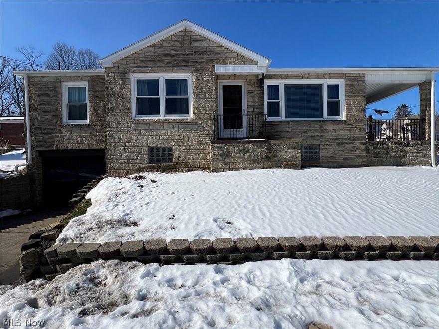 If you’ve been looking for a home with real character and "solid bones," this 2-bedroom stone ranch is a must-see. Sitting on a nice-sized corner lot, it’s got that classic look outside and a warm, updated feel the second you walk through the front door. You’ll immediately notice the rich oak woodwork that gives the whole place a cozy, high-quality vibe.
The kitchen has been fully updated and is ready for your first dinner party, while the bedrooms feature those gorgeous original hardwood floors that everyone loves. The bathroom has also been given a total refresh with clean ceramic tile and a convenient walk-in shower.
If you need more room to spread out, the large basement is already partially finished—it’s the perfect spot for a man cave, a playroom, or a quiet home office. Outside, parking is a total breeze because you get a 1-car integral garage plus an extra driveway, so there’s plenty of room for your guests or a second car. This is a solid, move-in-ready home that’s just waiting for its next owner to move in and enjoy!