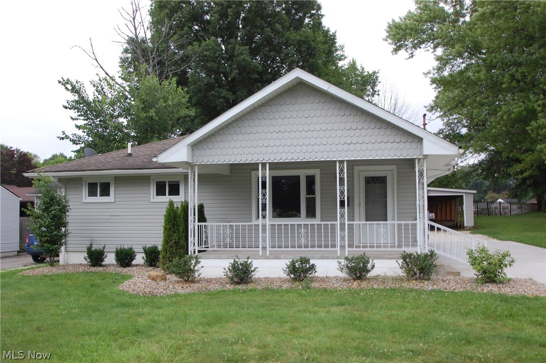 Totally updated ranch home with huge garage. This home features living room w/ refinished hardwood floors, Kitchen/dinette with new tile floor, new cabinets and countertops w/ all stainless appliances. The two bedrooms have refinished hardwood floors also and the 3rd bedroom has been turned into a first floor laundry. The main bath upstairs is all new as well. This also includes new paint and light fixtures thru out, new concrete drive, newer vinyl windows and roof shingles as well as newer high efficiency furnace and air. The basement has new pergo wood floor and 1/2 bath. The detached garage is huge 24x32 with heater and new garage door and opener. There is a nice covered front porch and this home is move in ready.