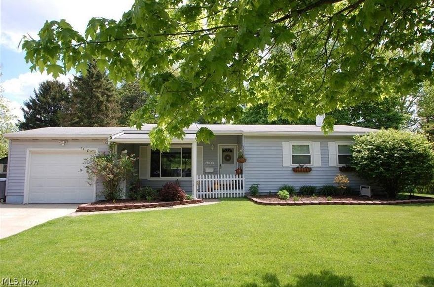 An exceptional 3 bedroom, 2 bath ranch with a finished basement.  This lovely home has a completely fenced/private back yard with an all brick patio and a hot tub.   Vaulted ceilings highlight the large living room that connects to the dining room.  There is an attached garage, front porch, new hot water tank, updated windows, laundry room, and so much more.