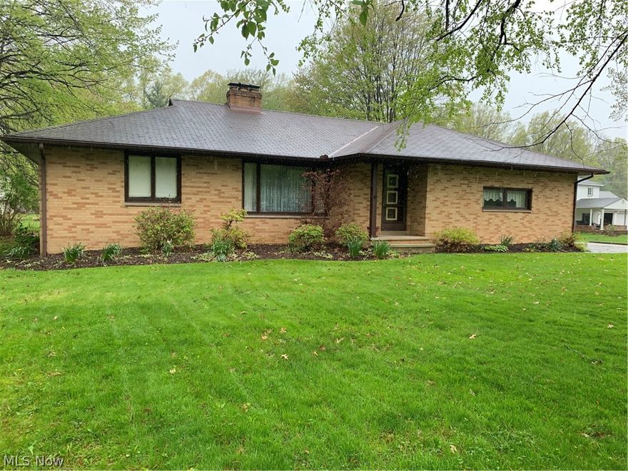 This well maintained brick ranch is nestled on just under one acre. One floor living with plenty of storage space in the full basement and walk up attic. Kitchen features white cabinetry with a brand new laminate flooring. Off the kitchen is the formal dining room space that has double doors to a covered concrete porch on the exterior overlooking a beautiful back yard. Two fulls baths and 3 bedrooms in the one owner property.