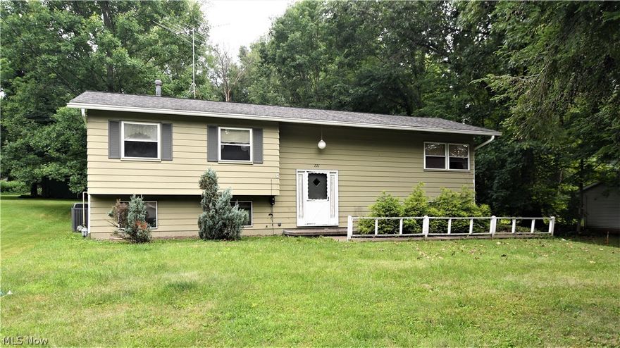 Gorgeous setting for this large bi-level. Huge screened porch off dining area for entertaining friends, 5 bedrooms! Lower level has wonderful light, 2 bedrooms, a bath and family room with access to two car garage and patio. Give it your touch/fixer upper.