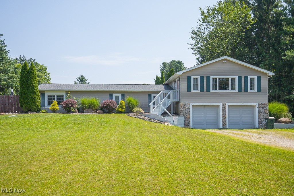 Say hello to this charming oasis nestled in Spring Valley, a lake community. On a sprawling 1.5 acre lot this house offers quiet country living just a short drive from downtown chagrin. Walk inside to be greeted by the tastefully finished open floor plan. A living room and dining room with heaps of natural light and a wood burning fireplace. Head down a few steps and find your oversized eat in kitchen featuring plenty of cabinet space, granite countertops and stainless steel appliances. Just down the hall you will find your 3 bedrooms. The primary bedroom walks out to your brick patio and also features a master bath with an oversized walk-in closet and a stand-in rain shower. The final level has features another bedroom/office space. The yard is tree lined-long and quiet. **AC unit replaced 2021** Optional $200 annual fee gains access to private swimming lake with beach