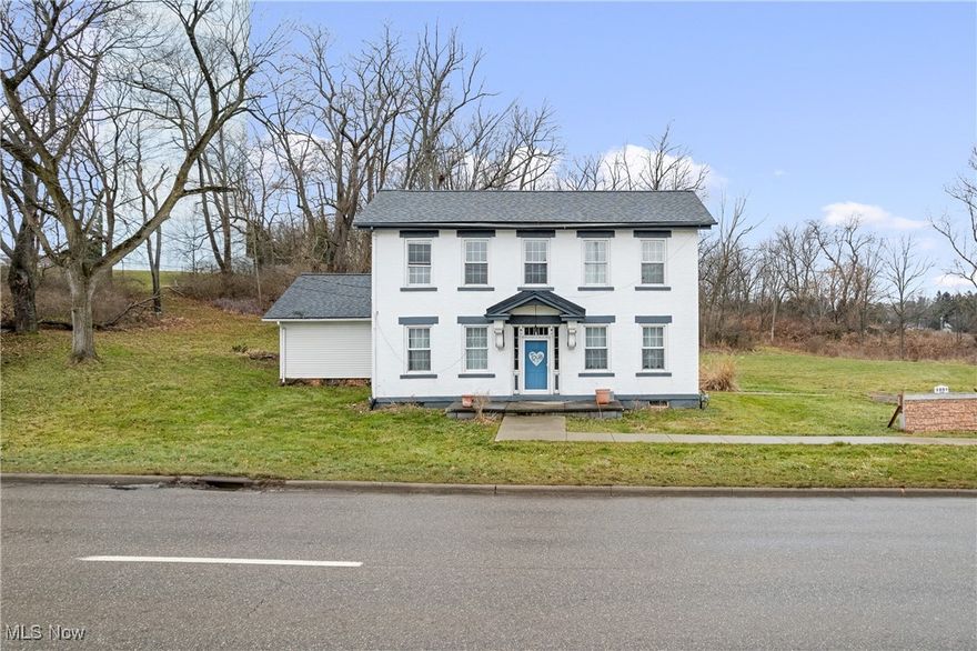 Steeped in history and architectural charm, this 1835 Federal-style farmhouse stands as one of the most storied residences in the county, offering a rare blend of 19th-century heritage and modern comfort in the heart of Canton. Spanning 2,604 square feet, the meticulously maintained interior showcases original details like rich hardwood floors, wide moldings, and warm exposed brick accent walls. The main level is designed for both quiet relaxation and grand entertaining, from the living room anchored by a stately stone fireplace to the vaulted family room with rustic beamed ceilings and French doors that open to a massive back deck. A grand dining area flows seamlessly into a cozy hearth room with its own wood-burning fireplace, while the kitchen delights with a classic tin ceiling and a functional butler’s pantry that doubles as a convenient mudroom. Modern peace of mind is ensured by significant updates, including a newer roof, electric panel, hot water tank, and water lines. This historic gem is situated on an expansive 13.27-acre estate, providing a sprawling, private sanctuary that is increasingly rare to find. Whether you envision a hobby farm, a tranquil nature retreat, or simply want to safeguard your privacy with vast open space, this property offers unparalleled potential to create your own legacy. Call today to schedule your private tour!