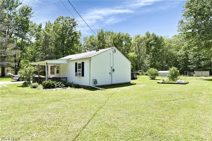 Prepare to be Moved!...into this North Ridgeville ranch on nearly 2 acres of partially wooded land. You're sure to be surprised as this cozy home offers more elbow room than meets the eye. Boasting two bedrooms, a full bath, a living room, a kitchen, and a dining room all with main floor laundry, the layout flows easily from space to space. The light, bright and sunny kitchen has plenty of prep area as well as cabinets! With several closets inside and several sheds out back storage at a premium. Enjoy a little bit of country in the suburbs on this large piece of property ready for just about anything you can throw at it.... want extra square footage, put on an addition... love to garden, expand the raised garden beds... enjoy tinkering with tools and toys, put up a pole barn... long for summer nights around a bonfire laughing with friends, add a firepit and benches. Let your imagination take flight in this expansive private yard. Conveniently located between 90 & 480, close to shopping