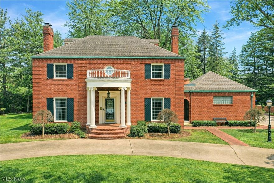 Commanding presence with an all-brick construction, four floors of finished living space and an exclusive location, this incredible Warren estate combines historic design elements and grandeur with comfortable, updated living! Its prominent corner lot quickly showcases each side of the home as the wraparound cement drive circles across the front for easy access. Towering pillars uphold a unique balcony over the formal entrance while a pergola topped patio graces the backyard. Not quite enough? How does a personal rooftop spa sound? Enter through the decorative glass door to find the elaborate staircase rising away as warm hardwoods run underfoot. First floor rooms include a fireplace adorned living room and study, window and mirror lined formal dining area, corner half bath and a substantial kitchen with lavish, stone countertops and fantastic backyard views. The second floor finds three bedrooms with a massive, oversized master that ties into the pass-through bath. An additional full common bath includes a stunning, tiled shower. Up to the third floor, two additional bedrooms raise the total to five as they enjoy their own full bath. Downstairs, the finished basement provides a wood paneled family or rec area with its own, stone lined fireplace. A fourth full bath completes the floor along with laundry and utility services.