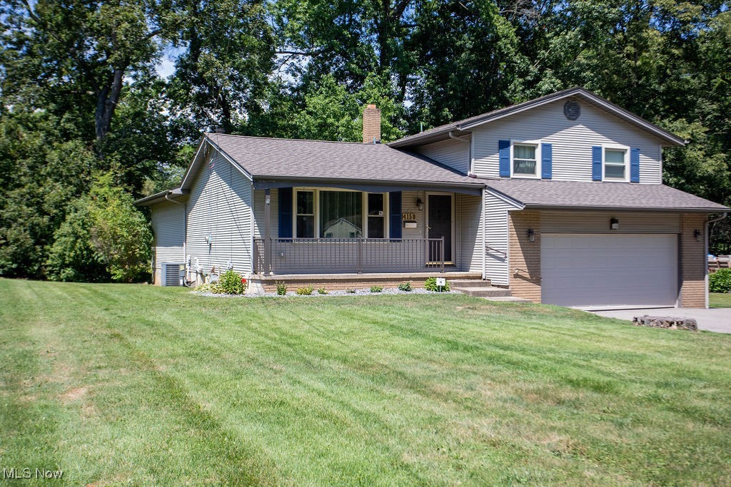 OUTSTANDING " multi level " vinyl sided home featuring a spacious family room addition with cathedral ceiling and fireplace! ATTRACTIVE vaulted living room and foyer entry that opens up to the eating area. Nicely appointed kitchen with view into family room which includes range, refrigerator, microwave and an updated built in dishwasher. Lower floor has a bonus room that can be used as a bedroom or office. Recreation room in basement creates an extra area for your specific needs. BEAUTIFUL upstairs bathroom plus you have a half bathroom on lower floor. The wall was removed between 2 bedrooms making the primary bedroom HUGE with dual closets. Many major updates that include high efficiency furnace and central air conditioning unit; large blacktop driveway including an area to back into for easy approach to street; large rear deck for all your summer furniture and entertaining;security system; double garage door with opener and where do I stop? Don't miss out on this opportunity...homes as nice as this are hard to find!