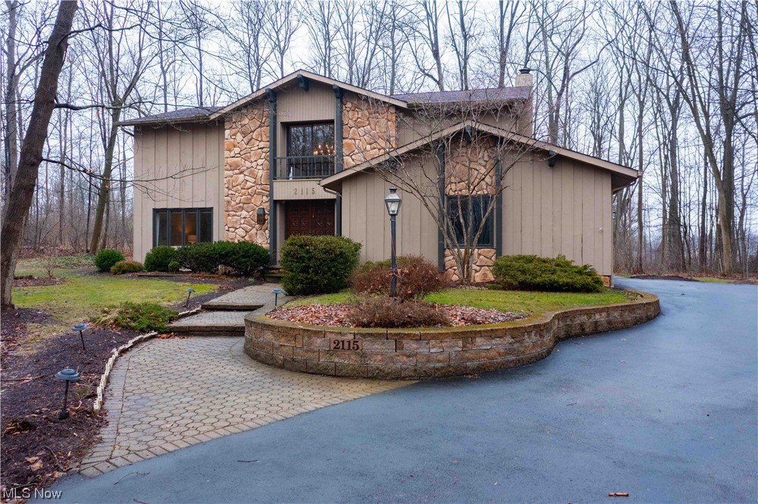 This 4-bedroom 3 bath home sits on a private wooded 2-acre lot in Weymouth Farms. Highland School district. You will fall in love with the updated kitchen with custom cabinets and granite counters, the morning room is full of natural light and offers views of the beautiful backyard. Formal living and dining room, family room has a fireplace, bar, and private office nook. The Master bedroom has a updated master bath and walk in closet with pull down steps to attic space. three addition bedrooms are all ample sized. The home has been freshly painted throughout. The home has an attached 2 car garage, shed, and a wonderful multi-purpose out building that can serve as a myriad of uses. The grounds are full of mature trees and landscaping. Basement js partially finished and was waterproofed 2/2024 with a transferable warranty. This property is a one owner home and is beaming with pride of ownership. Call today for a private showing.
