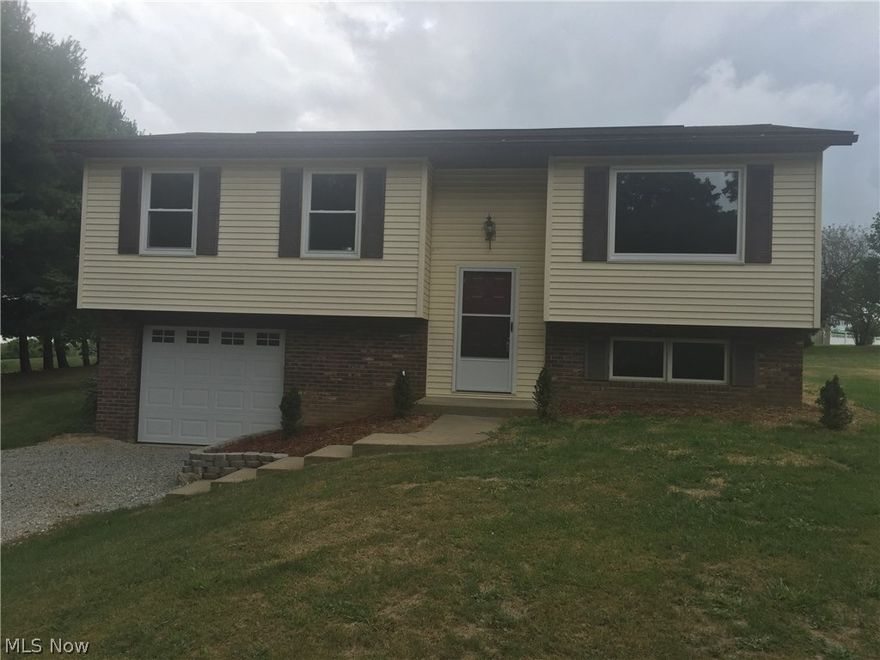 So much new in this 3 bedroom split foyer home. All new laminate flooring upstairs. Brand new t ton wall a/c for whole house. New ceiling fans and lights. New stainless steel appliances. New countertop and sink/faucet. New windows throughout. New front door and garage door. 200 amp service. New drywall in family room also new electric. Laundry room in basement could hookup 2nd bathroom. New aerator in septic.