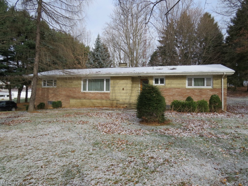 Nice Brick Ranch 3 or 4 Bedroom Home on 1.4 Acres near Carrollton! Well maintained home that features hardwood floors throughout, replacement windows, extra finished living area in the basement, an optional 4th bedroom with Jack and Jill bath, and wonderful treed lot next to a park. There's room for a large garden or to build a workshop, etc. Any minerals owned to transfer with property subject to current lease. Taxes without Homestead Reduction are $1040.73 per yr. Call to view this fine property!