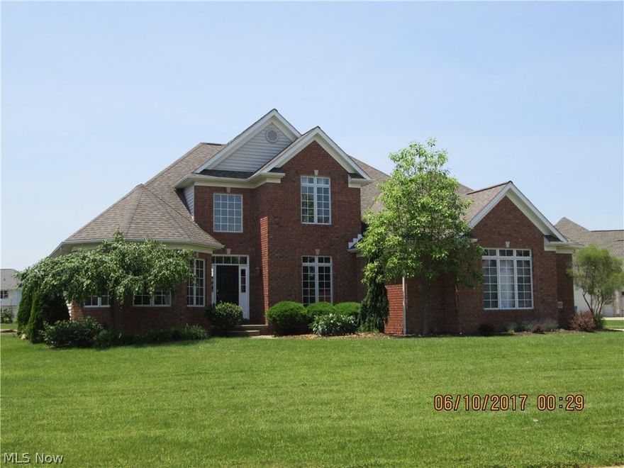 Stunning 4 BR,4.5 bath home with an open and flowing floor plan. There are large arched openings with rounded corners, iron spindled staircase, 2 story foyer, wood flooring in the great room, custom fireplace, bowed den with large windows and a privacy door and formal dining room with an arched entry. Located between the kitchen and the dining room is a butler's pantry for extra dining items. First  floor owner's suite has dual sinks, walk-in closet and tray ceiling. The second floor has a JR suite with a full bath, walk-in closet and a large window. Bedrooms 3 and 4 share a full bath. The large kitchen has solid surface counters, an island with eating space, tile flooring and an entry to the  stamped patio. Our large lower level has a custom home theater with 7.1 sound surround, 120" screen with  an LCD projector-- all that equipment will stay for the new owners. There is also a full bath, a kitchen area adjoining the theater room and another finished area that could be used for a pla