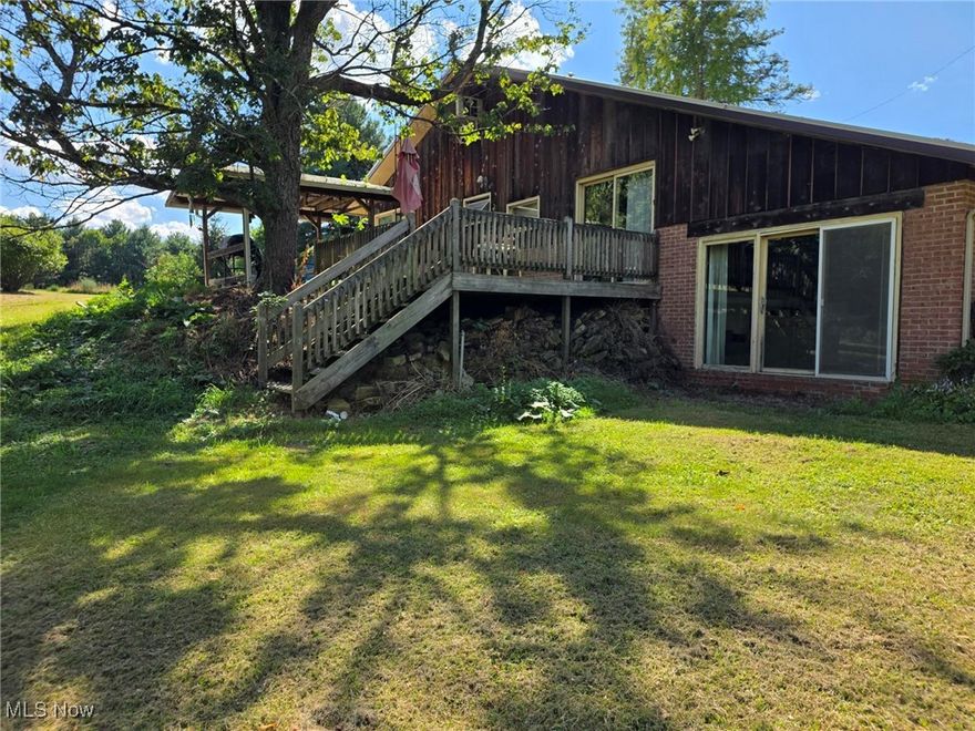 Welcome to this charming 2-bedroom, 1.5-bathroom home, situated perfectly on a peaceful 1-acre lot. Step inside and be captivated by the warmth of the living room featuring stunning voltage beamed ceilings that create an inviting atmosphere. The open floor plan flows seamlessly from the kitchen and dining space to the sunken Living area, making it ideal for both daily living and entertaining. upstairs, you will find two nice size bedrooms and an updated full bath with separate shower and jetted tub. On the third level, there is a loft area overlooking the lower level with plenty of storage. Outside, you will find an oversized three car, detached garage offering ample space for vehicles, a workshop, or all your storage needs. The one-acre property provides a serene retreat, with plenty of room for gardening, outdoor activities, or sit outside on the covered deck and enjoy the tranquil views. Located in a quiet area while conveniently close to local amenities, this home offers the perfect blend of rustic charm and modern convenience. Don’t miss the opportunity to make this peaceful retreat your own!