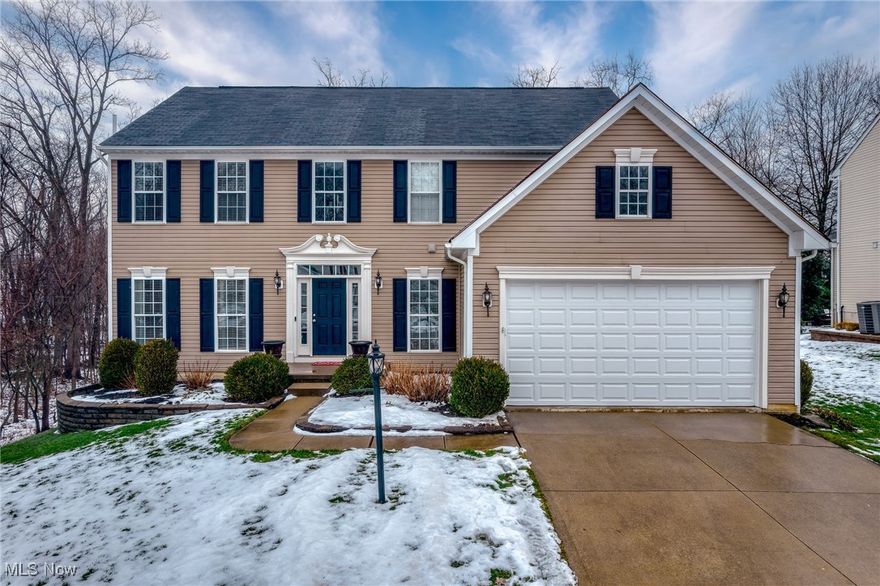 Welcome home to this beautifully maintained Colonial in Copley’s desirable West Ridge Estates. Nestled against a serene wooded backdrop, this 4-bedroom, 4-bath home (2 full, 2 half) offers over 2,700 square feet of light-filled living space and thoughtful updates throughout.

Step inside to discover refinished hardwood floors that flow seamlessly across the main level, setting a warm tone throughout the open-concept layout. The freshly painted interior enhances the home's bright and airy feel, while oversized windows frame tranquil views and flood the space with natural light.

At the heart of the home is a spacious, updated kitchen featuring crisp white cabinetry, sleek black countertops, stainless steel appliances (including a new stove and dishwasher), and a generous island with seating—perfect for entertaining or casual meals. Adjacent to the kitchen, the vaulted dining area is bathed in light from a stunning wall of windows, offering captivating views of the wooded yard year-round.
The expansive living room provides a relaxing space for gathering, while the finished lower level offers endless versatility—whether for recreation, fitness, hobbies, or work-from-home needs. There's also a convenient half bath and ample storage.
Upstairs, four generously sized bedrooms offer comfortable retreats, while the remodeled primary bathroom boasts a luxurious walk-in shower with custom tile, bench seating, and a marble threshold. Additional updates include luxury vinyl plank flooring in the main bathroom and an insulated garage door for year-round efficiency.
Enjoy outdoor living with a private backyard that backs to woods, offering both seclusion and scenery. The property also features a two-car attached garage, a spacious driveway, and access to a sidewalk-lined street within a friendly HOA community.
Move-in ready and meticulously cared for, this home is the perfect blend of comfort, space, and style—just minutes from parks, shopping, and major roadways.