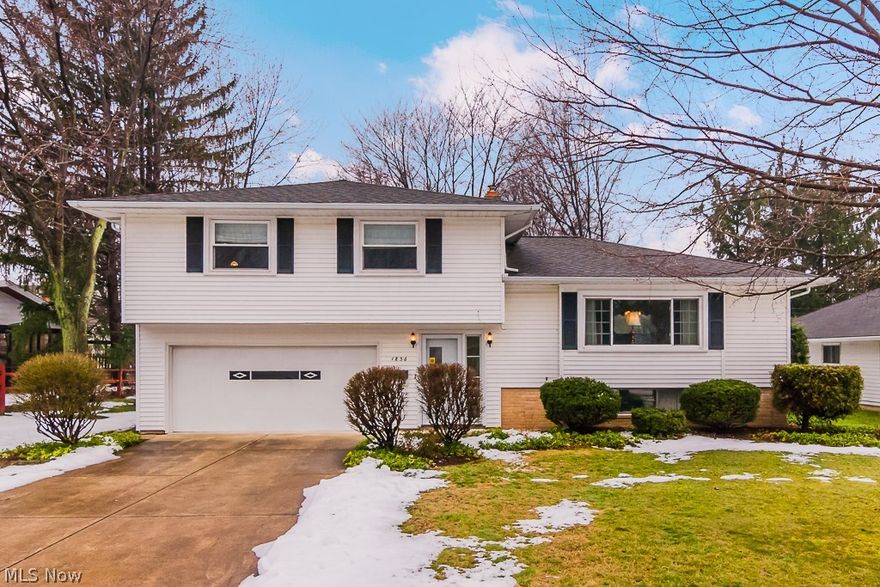 Beautiful Split level home with hardwood floors through out.  Large eat-in kitchen.  Living room has gorgeous crown molding and built-ins.  Bedrooms are all nice sized with large closets.  Basement is partially finished with separate laundry/workout area.  Laundry area has a stand-up shower and double wash sinks.  Vinyl windows throughout home.  Large backyard is fenced in and has patio area.  Electrical is dated.  Home has central air and comes with a one year warranty.  One owner home.  Move in ready!  Immaculate !