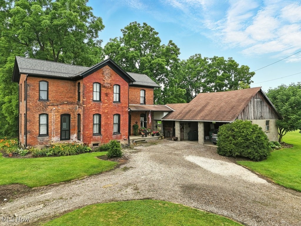 Built in 1876, this beautiful 4-bedroom, two full-bath Victorian-style home, situated on just over 5 acres, is filled with old-world charm and breathtaking woodwork. An adorable covered side porch welcomes you as you enter the main floor, featuring 10-foot ceilings, oversized windows, and doors, along with beautiful hardwood floors. A large kitchen provides ample counter space for all your cooking needs. A dining room, living room, bedroom, laundry room, and full bath complete the first floor. Three bedrooms and an additional full bathroom are found upstairs. A private patio space surrounded by flowers is located directly behind the house. The furnace was replaced in 2022, the Roof (2017), gutters & eaves (2022), hot water tank (2022), and aerator. Free natural gas supply from the well that is shared with several neighbors.