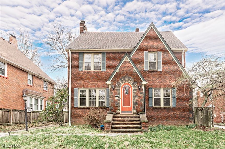 Classic Heights brick colonial with two full bathrooms on the second floor, one if which is attached to the master bedroom.  Beautiful architectural details include hardwood floors, leaded windows and crown moldings.  The spacious, light filled living room has a woodburning fireplace and original built ins.  The formal dining room with classic corner China cabinet.  Large kitchen with updated white cabinets and breakfast nook.  Sunroom features zoned heating and large bay windows which overlook the deep yard.  Large finish basement area.