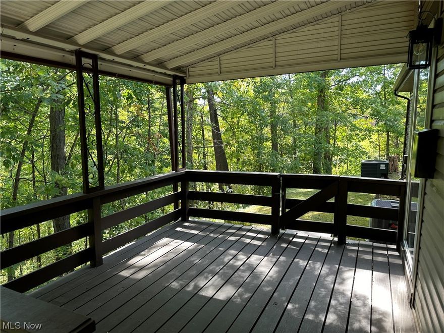 This home has been remodeled from the floors to the ceiling and completely down to the studs. Living Room, Dining Room, Kitchen, Hallway, Master Bedroom & Guest Bedroom all have waterproof laminate flooring. The Bathroom has Travertine Tile flooring and had all the fixtures replaced. All Light Fixtures & Ceiling Fans along with all the Appliances, and HVAC system being installed in 2018. Dining Room features sliding Glass Doors overlooking your own beautiful nature filled, secluded, wooded, private paradise. Just perfect for relaxing after work or just a small get together in the evening.You would never know you are living within the city. You are within walking distance to the Metro Parks System.