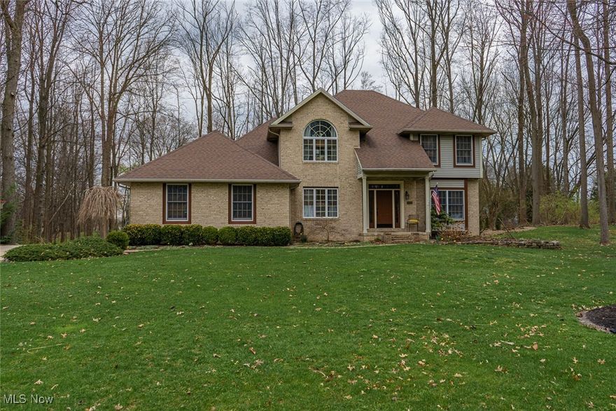 Welcome to this stunning two-story home in the desirable Mayfair Estates neighborhood, located in the sought-after Green Local School District! From the moment you step into the grand two-story foyer, you’ll be impressed by the warm wood floors that flow throughout most of the first floor.
The formal living room, currently used as a home office, offers a quiet and versatile space. Enjoy an open-concept layout that connects the spacious great room—complete with a gas fireplace and a wet bar.  Patio doors walk out to inviting outside to the beautifully landscaped backyard with a patio that includes a serene pond—an ideal space for relaxing or entertaining.  The kitchen features granite countertops, a center island, rich cabinetry, pantry, and stainless steel appliances. The adjacent formal dining room is perfect for hosting guests. 
Convenience abounds with a mudroom, a first-floor laundry room with washer, dryer, sink, and cabinetry, and plenty of storage throughout the home.
Upstairs, the owner’s suite offers a peaceful retreat with a electric fireplace (included), a large jetted soaking tub, dual vanities, and a generous walk-in closet. Three additional bedrooms and a full bath with dual sinks complete the second level, accessible via a dual staircase.
The finished basement adds even more living space, including a large rec room with fireplace, a dedicated workout room, and additional storage. A spacious 3-car garage and a newer furnace (2021) add to the home’s appeal.
This home truly has it all—space, comfort, and style in a picturesque neighborhood!