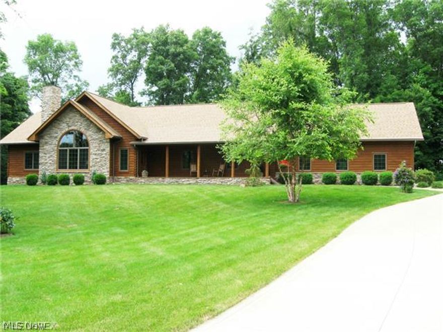 Finely crafted, Custom Amish-built Log Home by Walnut Valley Log Homes - Marion Miller!  Until you live in a Log Home, it is very difficult to express & understand the heart-warming emotions of "Being at Home."  Having designed & built my Log Home, I can help you with your questions about Log Homes.  A gorgeous 2,722 sq ft Ranch on this 2.6 Acre beautifully landscaped and privately treed site was lovingly designed & built in 2006. Everything is top quality from the Gold Series Whirlpool appliances in the Gourmet Kitchen to the 400 E-Series Anderson windows. One of the first decisions the owners made was to upgrade to kiln-dried logs. The floorplan is exactly what most buyers are looking for: Very open w the warm Entertaining Triangle of the Open Kitchen w Breakfast Bar, Great Room w Fireplace & Vaulted Ceilings and large Eating Area where all can gather "together." Focal points include the Stone Fireplace in the 25x24 Great Room w Soaring Windows & Beamed Vaulted Ceiling open to Eating