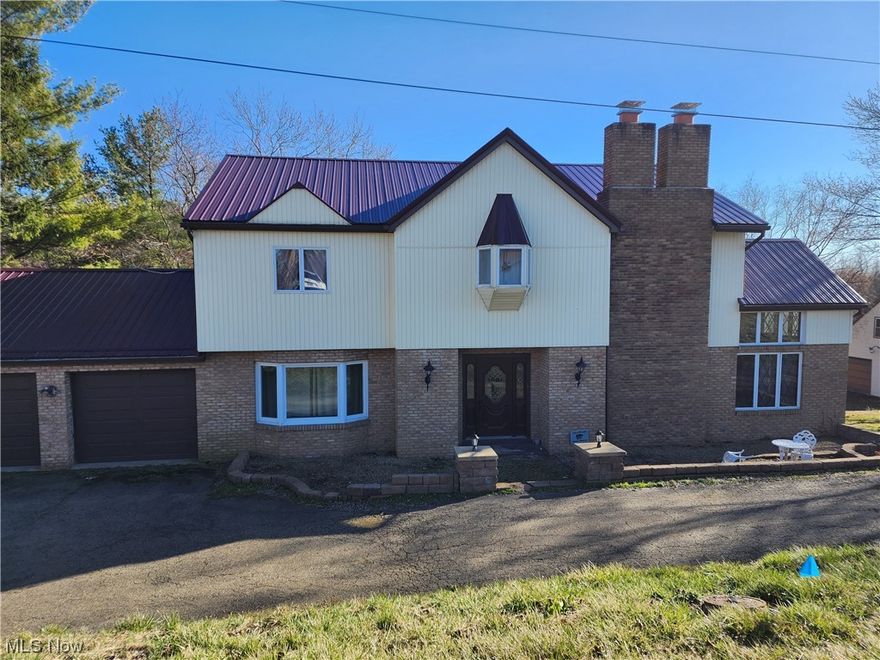 If you are looking to upsize, this is the house for you!  As you first walk in, there is a large living room with a cathedral  ceiling and a cozy fireplace. The kitchen has been recently updated and has granite countertops. The laundry is conveniently on the first floor.  The upstairs is very spacious and includes 2 bathrooms. Downstairs is a massive recreation room with a kitchenette, office and game room.  The home has 2 attached garages and a 2 car detached garage. There is a loft on top of the detached garage.