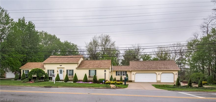 Custom updated house.  3 or 4 bedrooms with walk out deck.  Meticulous landscaping.  Roof is 5 years old. Hot water heater and furnance only 2 years old.  Great location!