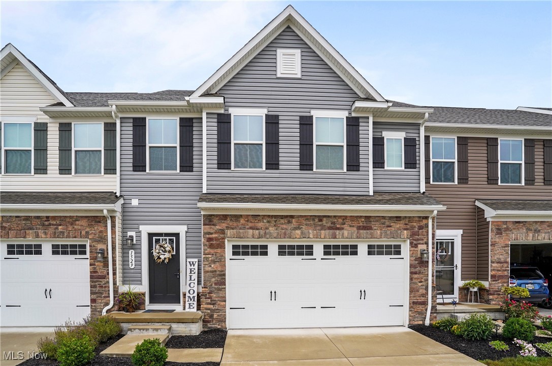 Here's an opportunity to live in the beautiful new upscale Stow community (just off of Darrow Road at the border of Stow and Hudson) named "Towns of Cedar Crest" This townhome was just built in 2021 and it is still in impeccable condition. The open floor plan is designed to be filled with natural light throughout. The color scheme is light and bright with soft neutral tones in every room. The spacious Great Room is open to the kitchen and dining area. The kitchen is very appealing with rich expresso colored 42 inch upgraded cabinets, stainless appliances, a large island with breakfast bar and beautiful granite counters. The sliding doors from the dining area lead to the backyard with a nice green lawn space overlooking an attractive landscaped mound that borders the community. Finishing out the first floor is a 1/2 bathroom, access to the garage and an unfinished basement offering wide open spaces to utilize. The second floor has three spacious bedrooms, double closets in the master bedroom, 2 full bathrooms and a loft area for work or play. Take advantage of this opportunity to enjoy carefree living where the exterior maintenance is included with townhome living!