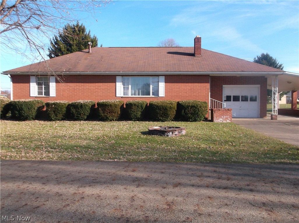 Come enjoy this nice 3 bedroom brick home. Home has beautiful wood floor in the bedrooms. Large kitchen. Home has 1 car attached garage and an attached carport. Level yard and a storage building.