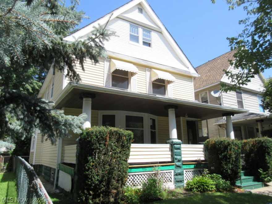 Large 2 story Colonial home with 4 bedrooms, 2 full baths. Deco fireplace in living room. Natural woodwork throughout. Dining room with a window seat plus an eat-in kitchen. Enclosed porch off bedroom. Floored attic for additional storage. Full, unfinished basement has glass block windows. 2 detached garage inside a fenced yard. Access garage from alley.