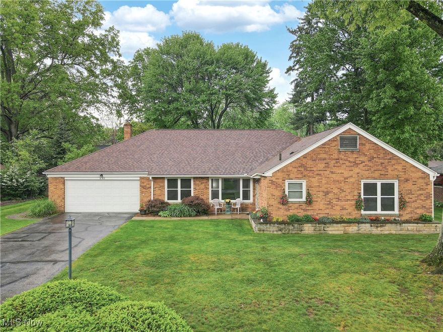 If only the best will do, you'll have that and more in this 3-bedroom, 2.5 bath Merriman Hills ranch that I bet you thought you’d never find. Immaculate and meticulously maintained, you’ll be able to tell the quality of the build the moment you drive up. The brick exterior is not only beautiful, it’s durable, weather proof and is energy efficient. Inside is a gracious floor plan that features a 20 ft. long living room and 19 ft. family room, that the owners use as a music room. The dining room is lovely. It leads to the pretty kitchen with loads of Shrock soft-close cabinets, gorgeous quartz countertops and stainless steel appliances. The bedrooms are on the other side of the home. The master bedroom has an ensuite bath that's been remodeled with double vanities and a custom-built shower. The hall bath has been remodeled and is charming, as well. Large enough for two desks, one of the bedrooms currently serves as an impressive home office, with floor-to-ceiling storage cabinets and a built-in desk in between. You’ll love the comfortable and efficient radiant floor heating. It warms everything in the room, including surfaces and furnishing, as well as you! You can access your beautiful rear yard, featuring composite fencing, hot tub and pretty landscaping through either the cheerful, air conditioned, 3-season sunroom, or off of the super large utility room that comes with a front-loader laundry set up. New roof, central air and replacement windows were installed in 2020. Even with no steps here, your opportunities for storage are huge, in either the utility room, the garage itself, or above in the huge attic with pull down attic access. If you favor a sense of community, the owners have loved their neighbors and have said they’ll greatly miss their walks in the nearby Delaware neighborhood. Add in being near Stan Hywet, not far from Highland Square and Summit Mall, plus close to the bike path and the Cuyahoga Valley National Park, and this one is a sure winner!