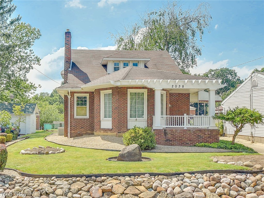 Impressive Brick Cape/Colonial in desirable Falls neighborhood. Appealing curb appeal with cozy front porch,concrete driveway and attractive landscaping. The front door steps into the cozy circular sun room. This home has been maintained in excellence, extensively remodeled and kept in pristine condition. Floor plan reconfigured and well planned out to create an open concept that is light and bright with the kitchen opened to the dining room with a bay window and the formal living room with a fireplace. Custom made weathered oak kitchen cabinets built on site with corian counters,white tile back splash, huge 96"island/breakfast bar,ceramic tile floor, stainless appliances, hidden trash and recycle containers, plus a wine rack! Gorgeous hardwood floors throughout the first floor,many rooms with crown molding, newer six paneled doors and most all light fixtures replaced too. Two spacious bedrooms on the first floor with double closets plus a beautifully remodeled bathroom with double si
