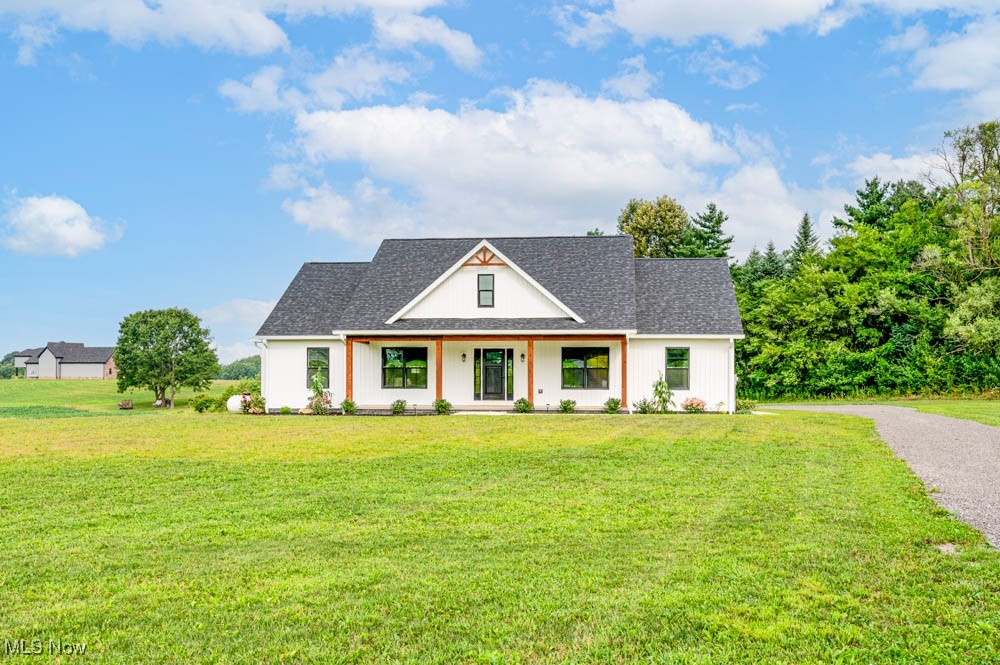 This stunning, modern ranch home offers large 2-acre lot sitting in a quiet cul-de-sac. The 2100 square feet of thoughtfully designed living space, blending comfort and functionality. This home features 3 bedrooms and 2 1/2 baths. This single-story home is perfect for those seeking spacious, accessible living. The open concept main level features large cathedral ceilings with a fully equipped large kitchen w/ pantry and an island that seats 4 that flows seamlessly into a large great room w/beautiful gas fireplace and front door that opens up onto large covered front porch. The dining room looks out onto covered back porch and large private backyard. The master suite is a private oasis with a spa-inspired ensuite and generous walk-in closet space ready to be configurated to your liking, soaking tub, his and her vanities and walk-in shower. A door from the walk-in closets leads you into a large laundry room which is great for convenience. Two additional bedrooms feature a Jack & Jill bath. The LL is a wide-open space and with modifications could make a great rec room or game room adding additional living space. A nice mud room with build ins lead you out into large 2 car garage with a great feature of steel siding and ceiling making it maintenance free. Call today to set up your private showing. You will not be disappointed.