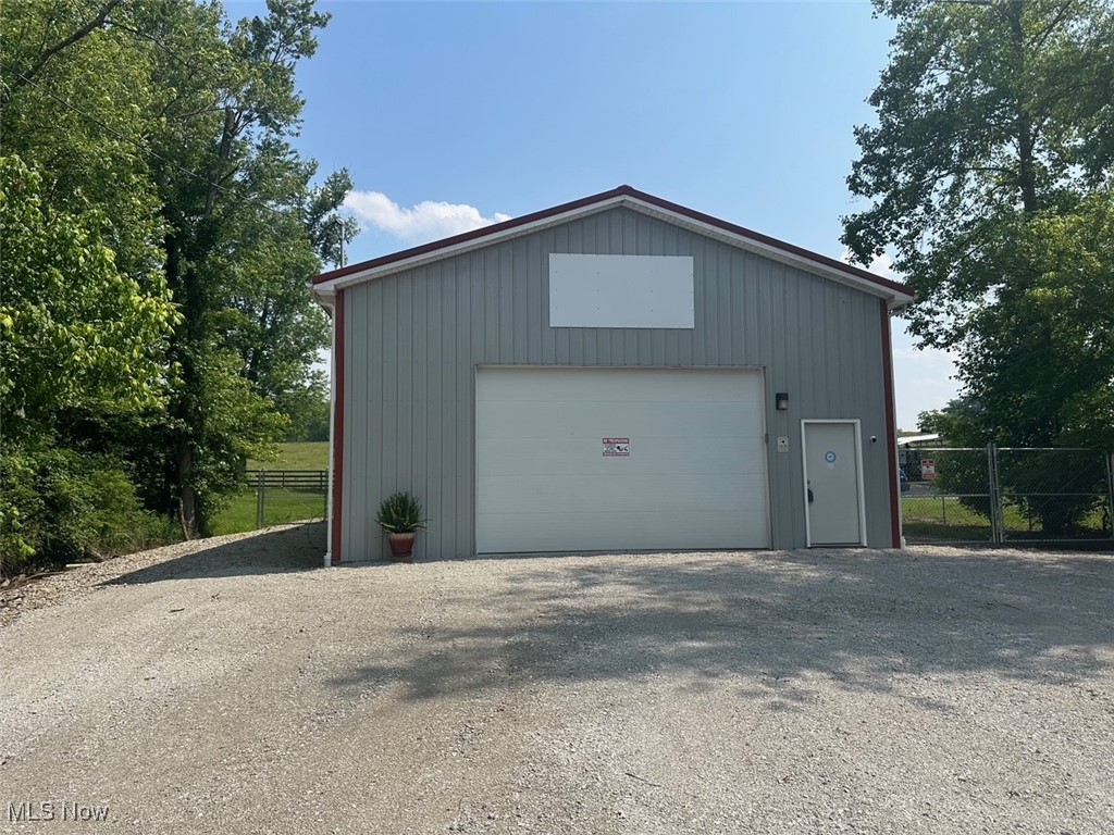 One of a kind property that could be used for commercial or residential living. The building is 30'x60' with 16' ceilings offering a 12' garage door that you could make taller. Lower level offers a 12'x30' that offers a room for painting, etc., and a half bath and laundry area. There is an upper level that is 12'x30' offers a full bathroom with office/kitchen/lunch area. This area could easily be a small efficiency apartment. Some many options with this property including possible weekend getaway, commercial building for business, rental or residential living. Does have a river view and just a stones throw away from Northbend Rail Trail. Property has public sewer and water, gas, electric, and internet. Office area offers a Mitsubishi split for heat and cooling. Lower level garage area offers heat. 200 AMP with one corner offering an additional 50, 30 and 20 AMP. Outside has a dump station for a camper. Parking behind a chain length gate. This is also a perfect property for a snow bird that wants a place to land during summer months. Built with quality and to FEMA guidelines. $50.00 annual road maintenance fee.